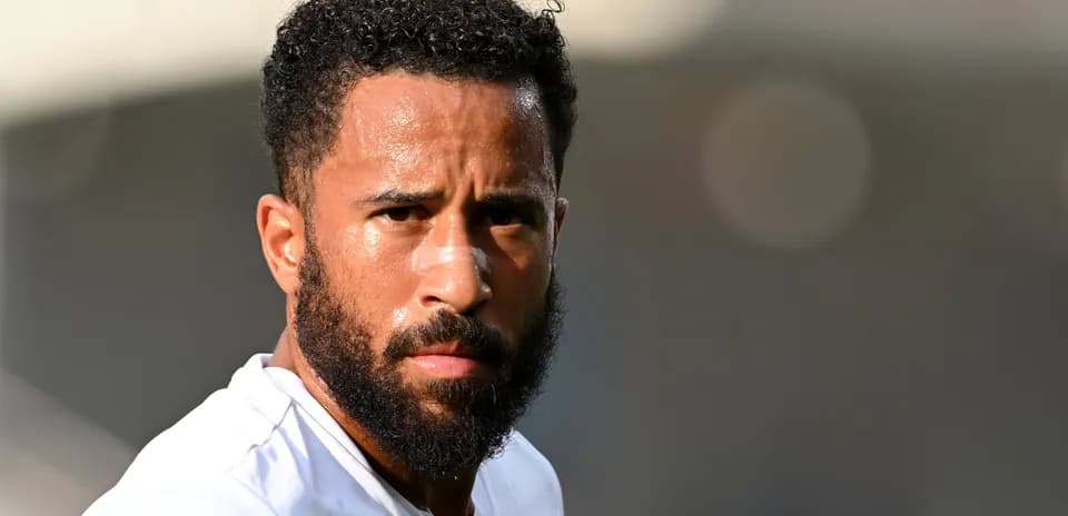 Player with beard and bandage during warm-up