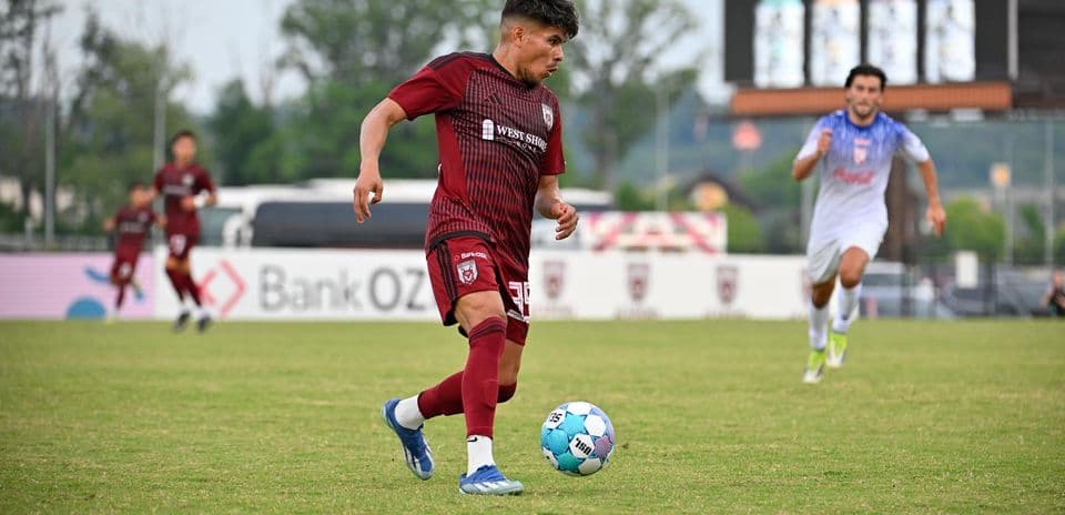 Player dribbling ball during One Knoxville match
