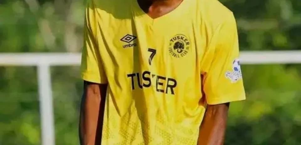 Player celebrating in yellow jersey after scoring