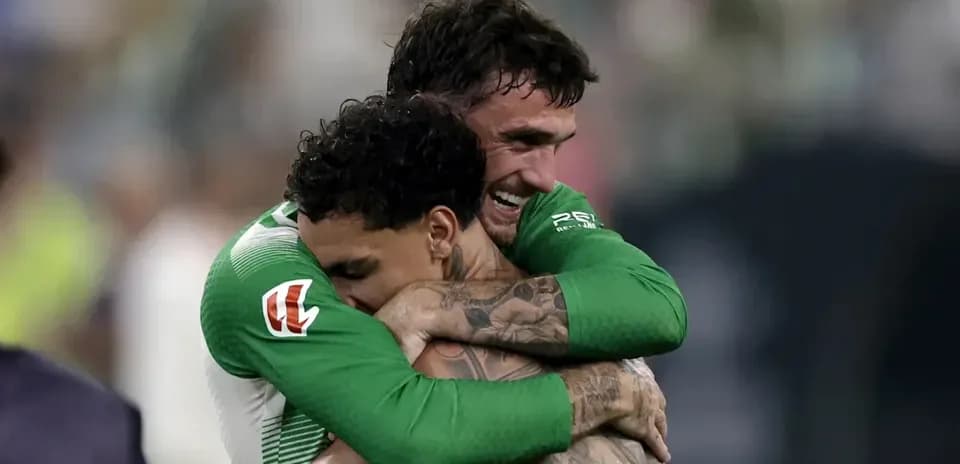Two players embracing after a match victory