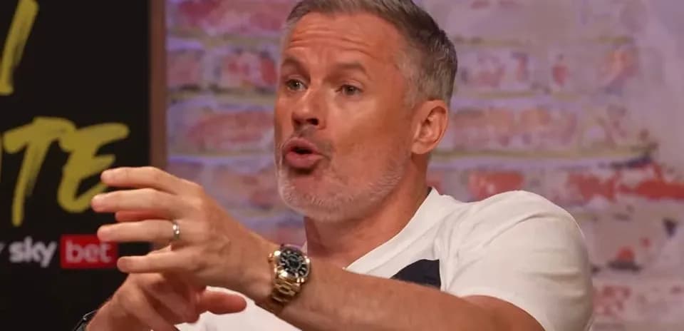 Man discussing animatedly at a talk show set