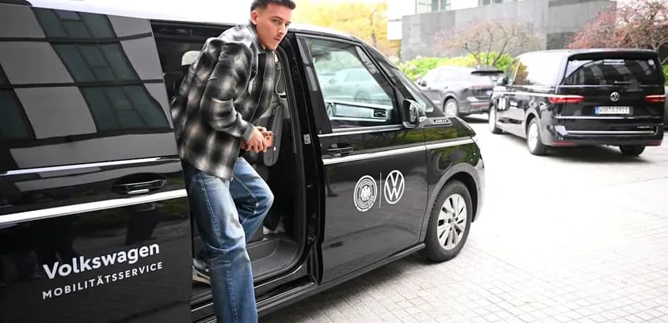 Player exiting Volkswagen vehicle at venue