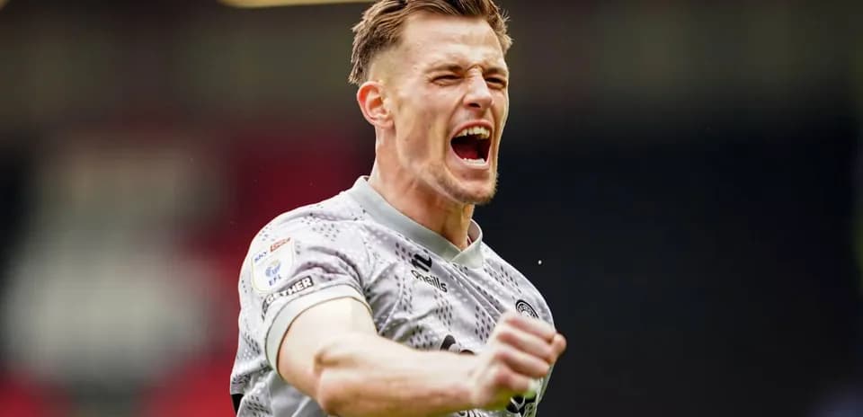 Player celebrating a goal with raised fists