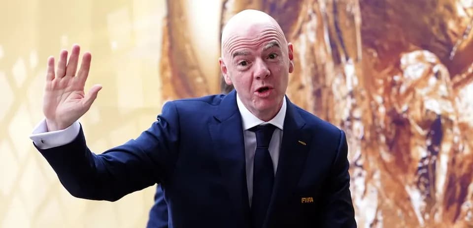FIFA official gesturing during an event