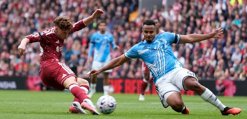 Two players competing for the ball during match