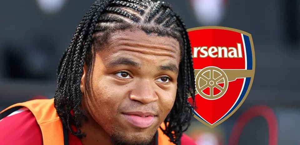 Player with braided hair and Arsenal logo backdrop