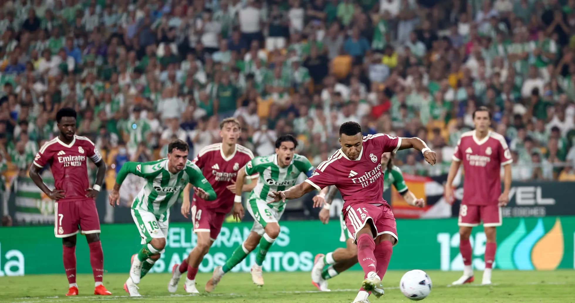 Player taking a penalty kick during match