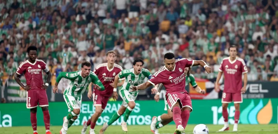Player taking a penalty kick during match