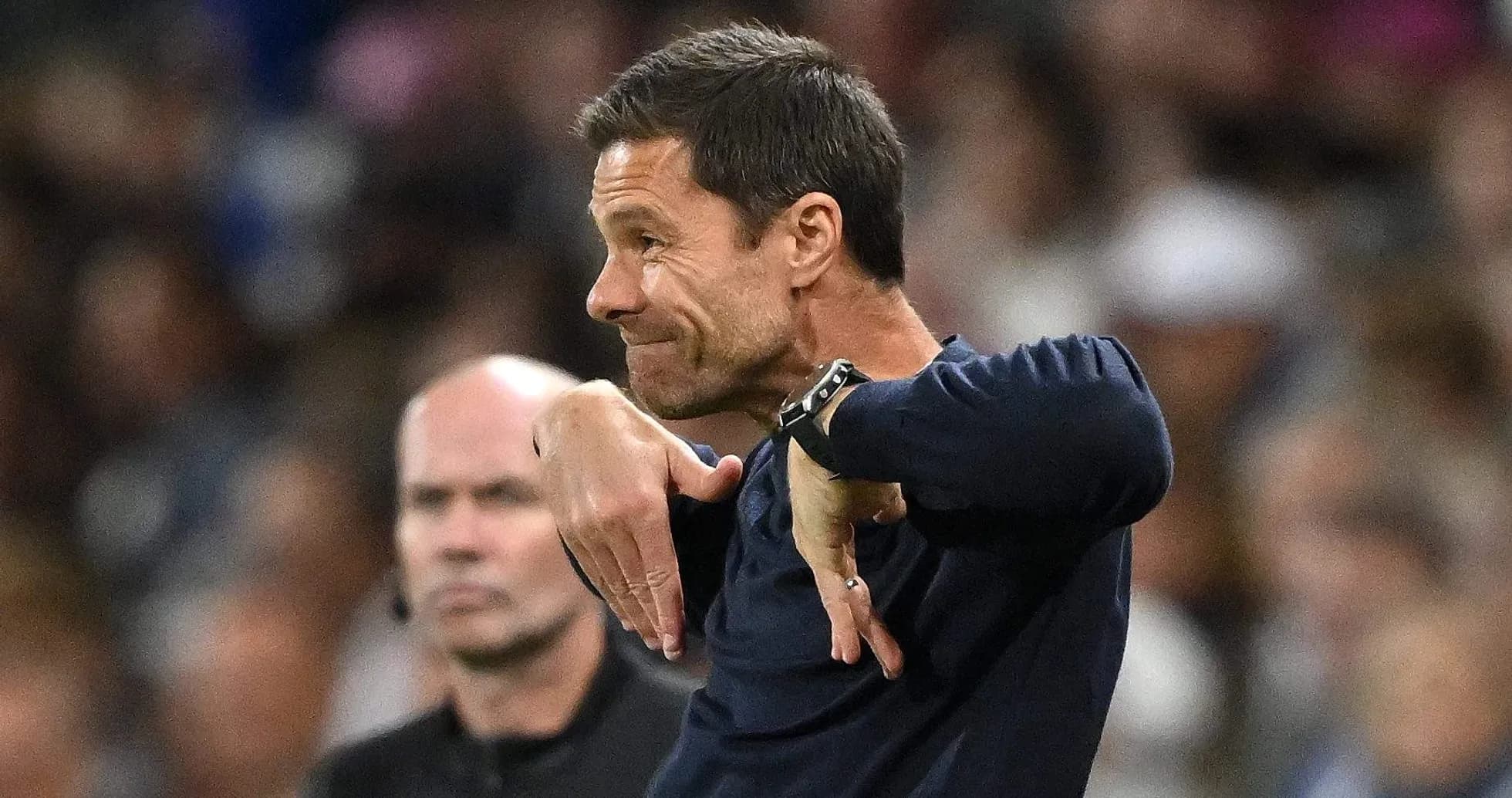 Coach gesturing on the sidelines during a match