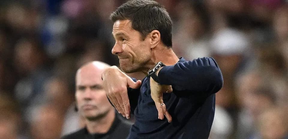 Coach gesturing on the sidelines during a match