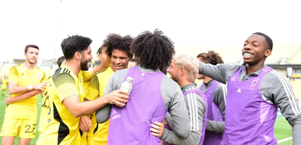 Columbus Crew II players celebrating together