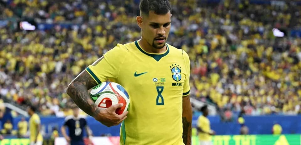 Player in yellow jersey holding a soccer ball