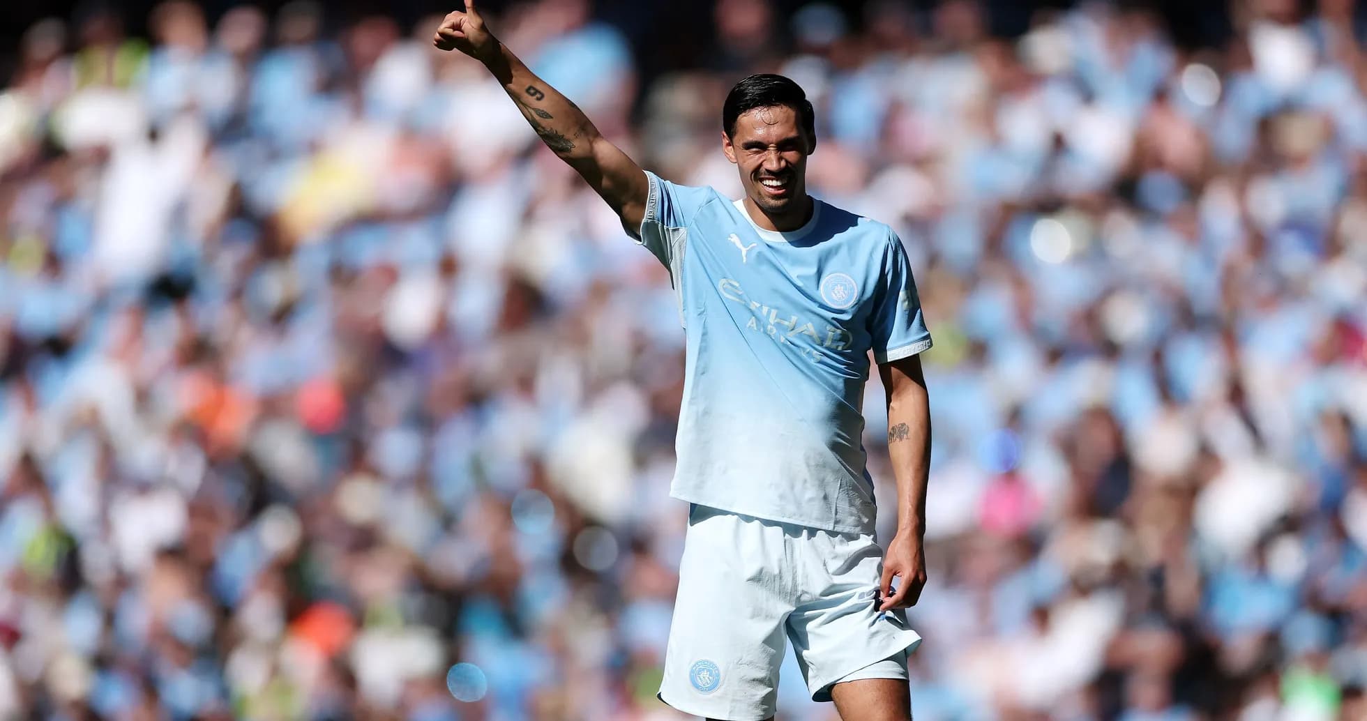 Player gesturing to crowd during match at stadium