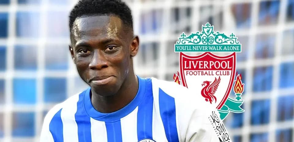 Player in Brighton jersey with Liverpool logo background