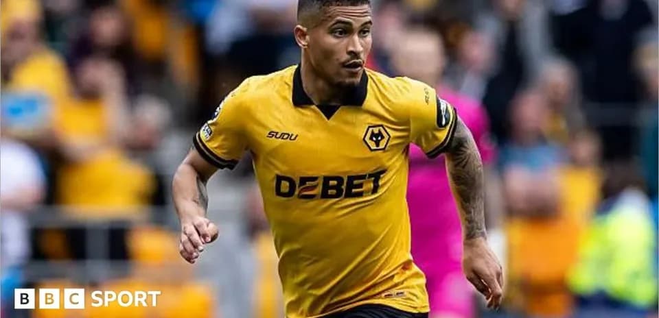 Player in yellow Wolves kit running on field