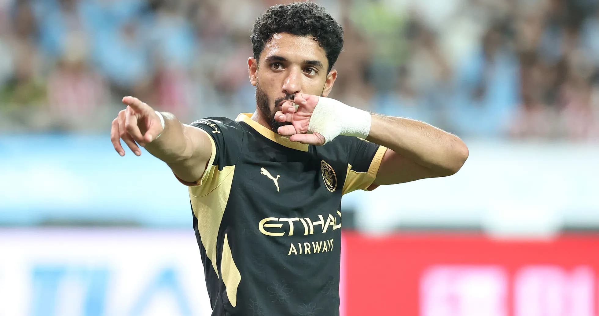 Player celebrating and pointing during a match