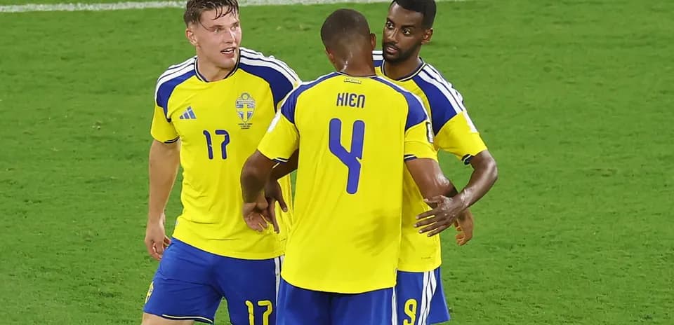 Sweden players celebrating during a football match