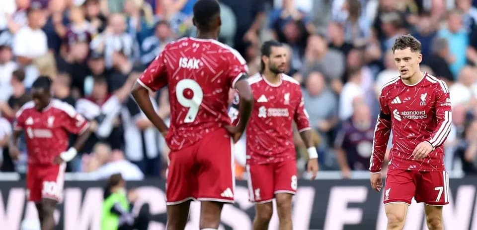 Liverpool players walking on the pitch during match