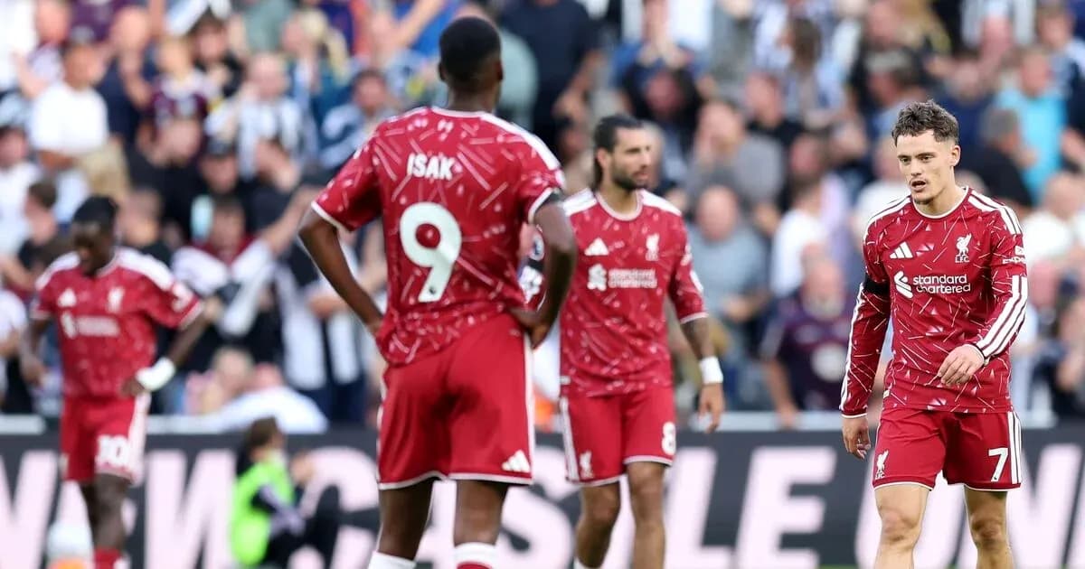 Liverpool players walking on the pitch during match