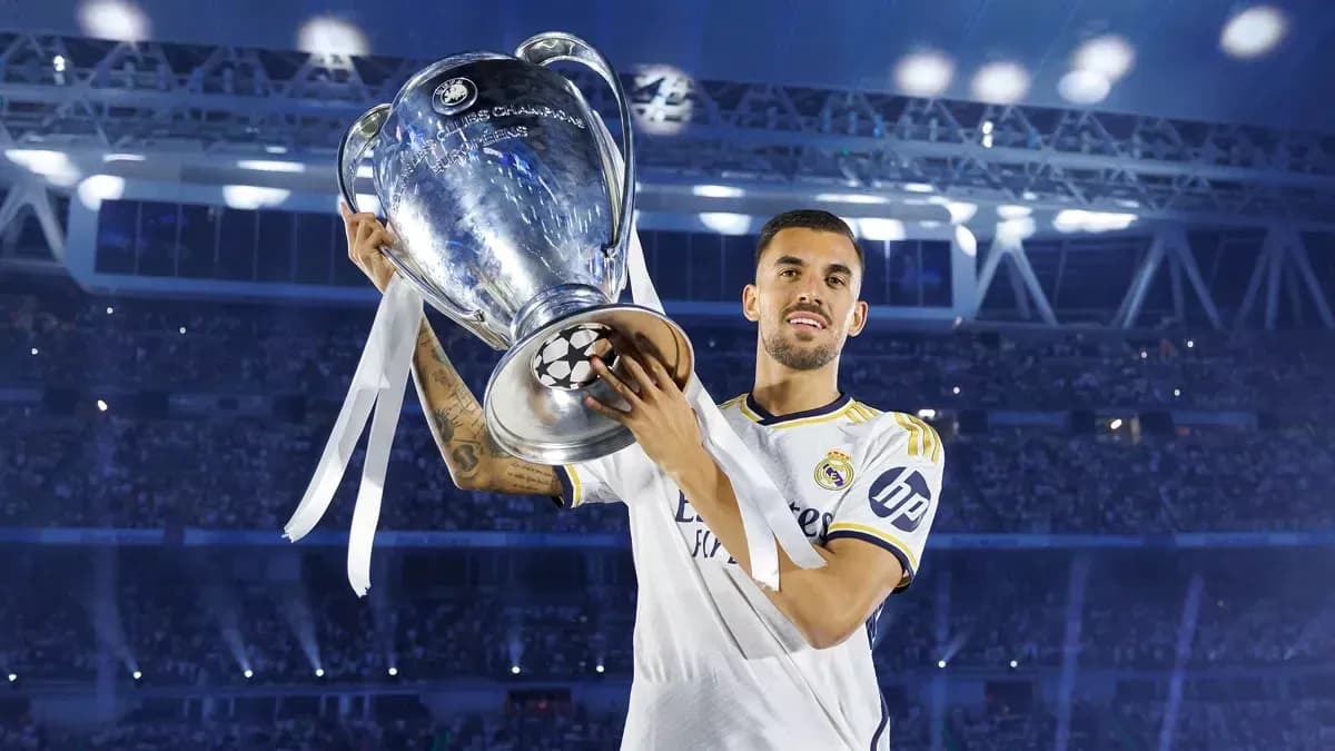 Player holding UEFA Champions League trophy aloft