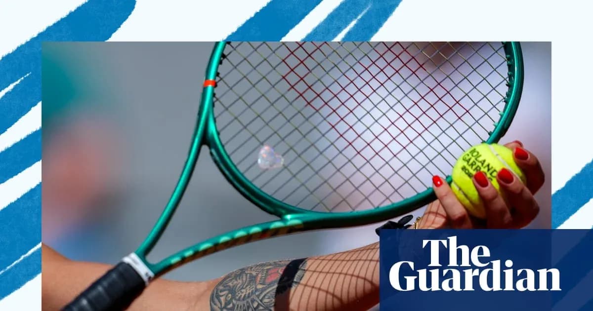 Close-up of tennis racket and ball in hand