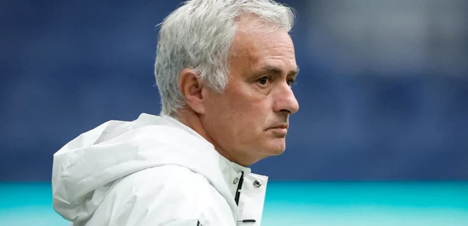 Coach observing from the sidelines during match