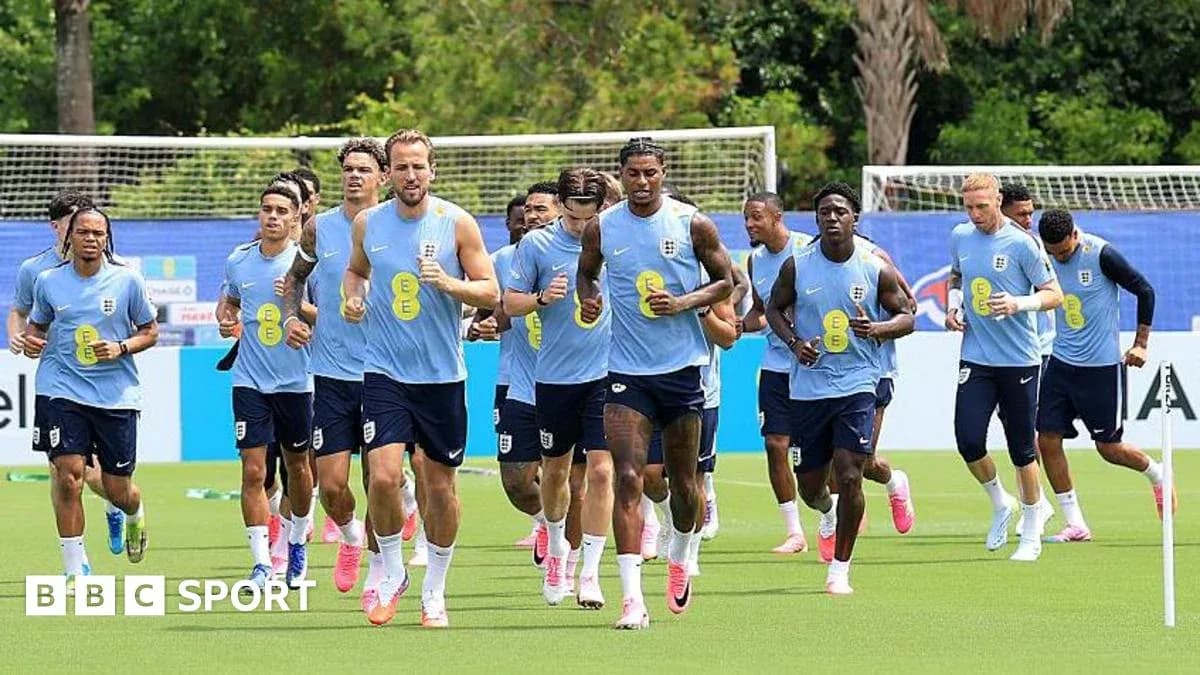 England team jogging during training session on pitch
