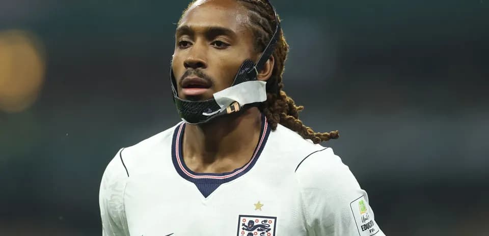 Player in England kit with protective facial mask