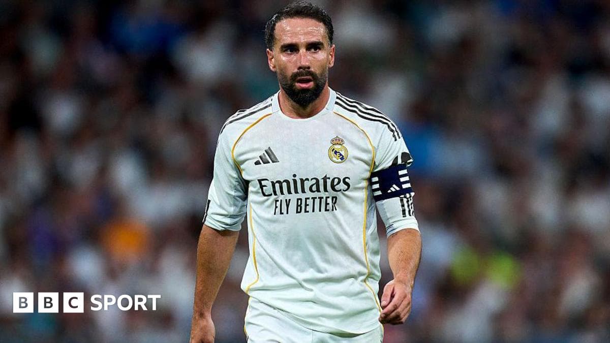 Player wearing Real Madrid kit on the pitch