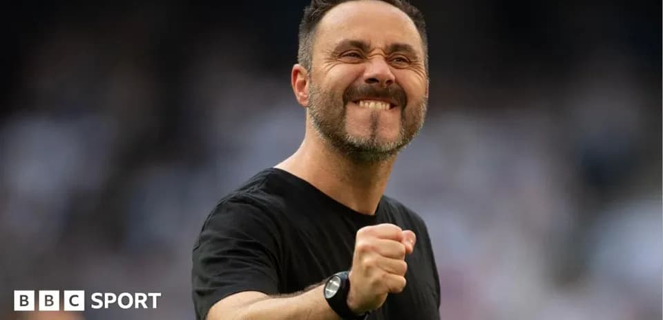 Coach celebrating with a clenched fist on field