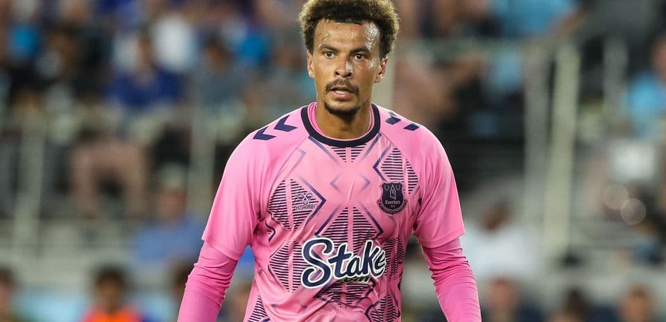 Goalkeeper in pink jersey during match action