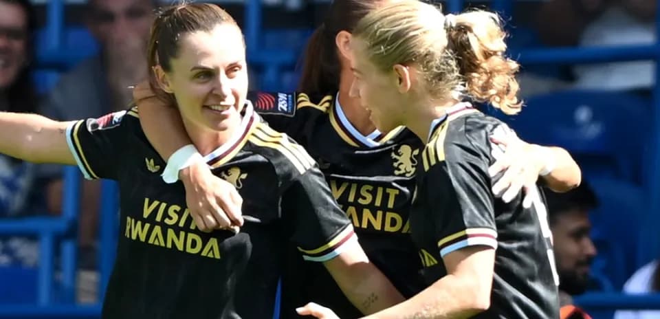 Players celebrating a goal during a match