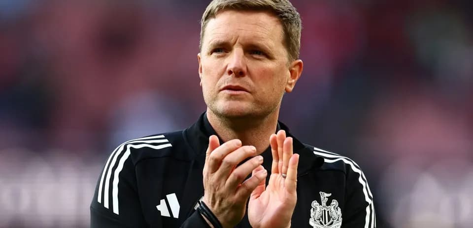 Newcastle United manager applauding fans on pitch