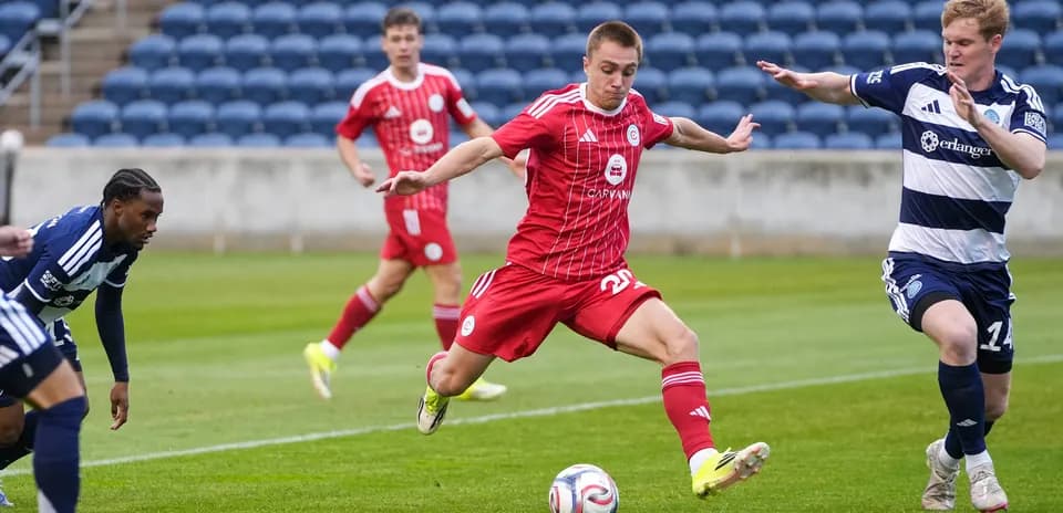 Chattanooga player dribbling past Chicago Fire II defenders