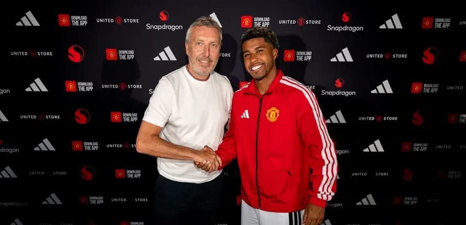 Player and official shaking hands at signing event