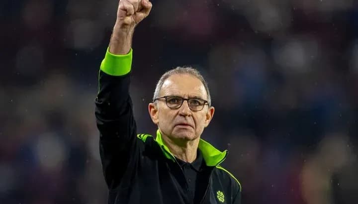 Manager raising fist in celebration at match