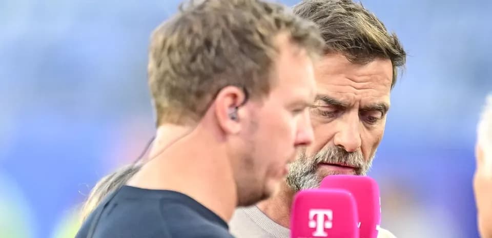 Two commentators discussing near microphones on set