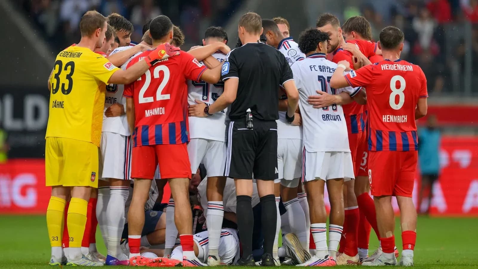 Players from both teams gathered around an official