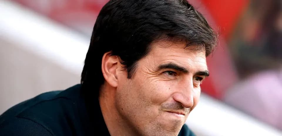 Coach sitting on the sidelines during a match