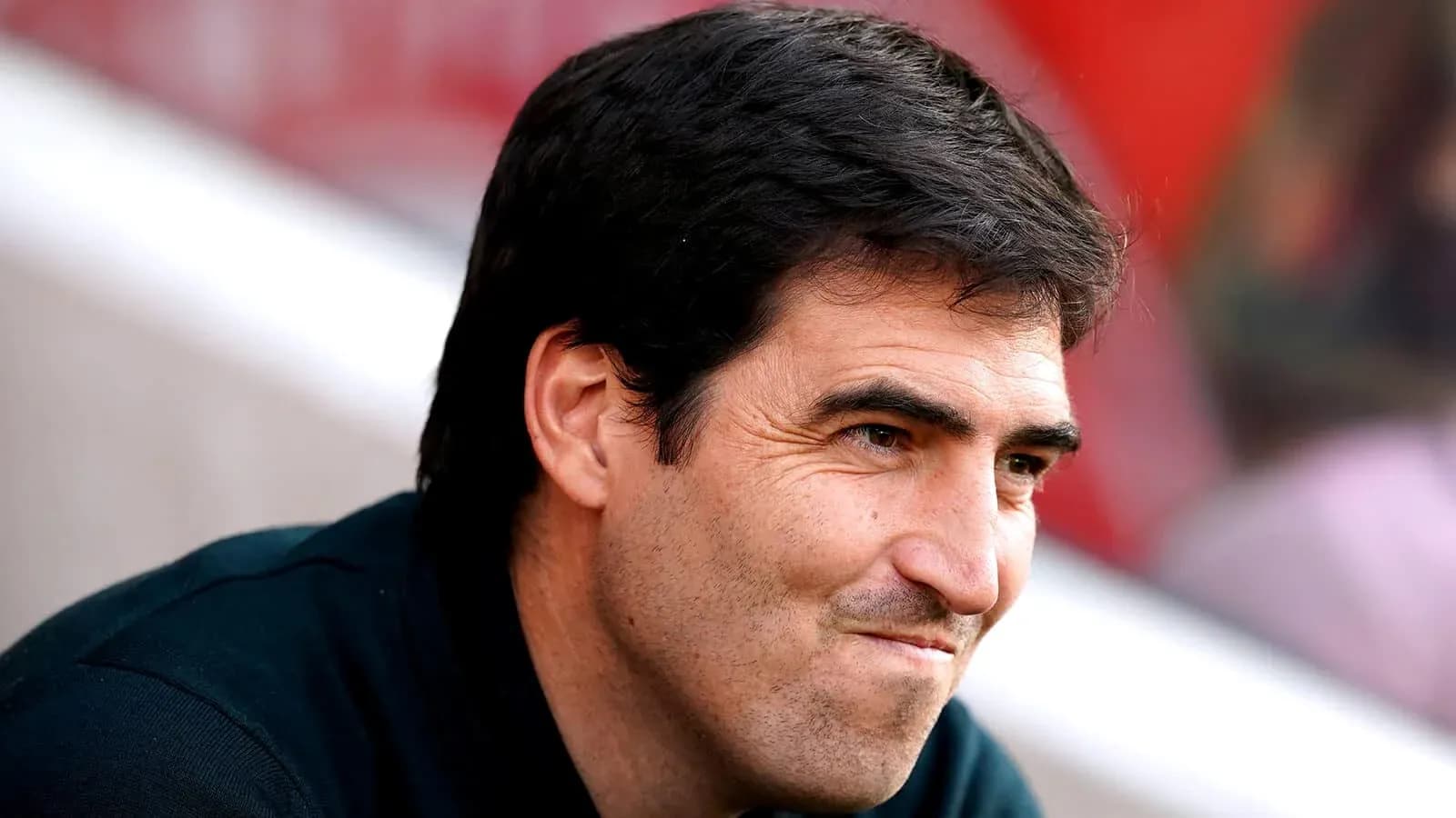 Coach sitting on the sidelines during a match