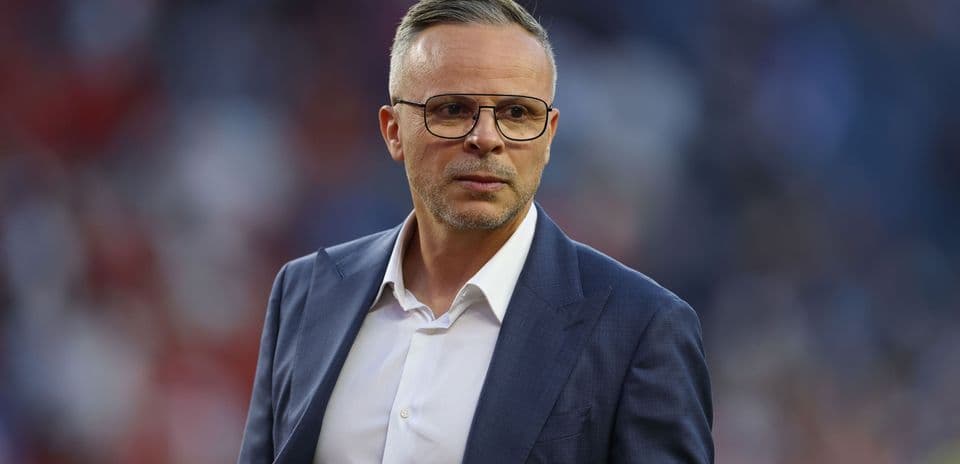 Coach in suit during match on field