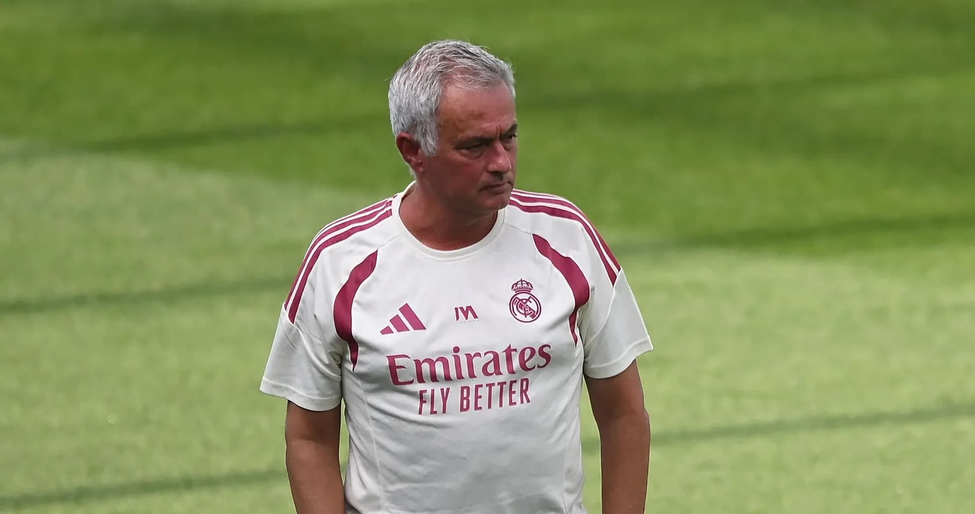 Coach walking on training pitch at Real Madrid