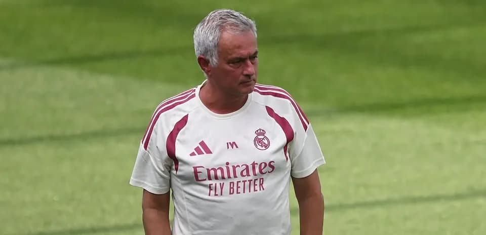 Coach walking on training pitch at Real Madrid