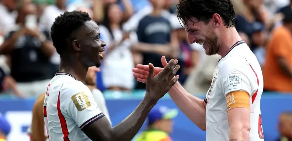 Two football players celebrating after a match