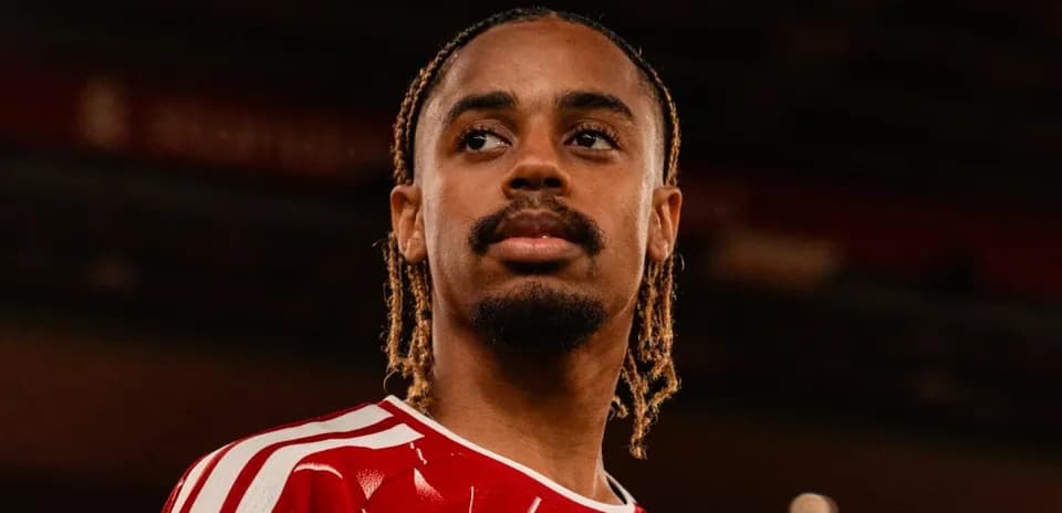 Player in red jersey looking off-camera