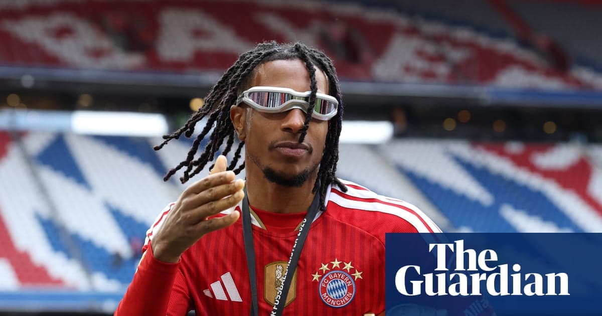 Player in Bayern Munich kit gesturing on the pitch