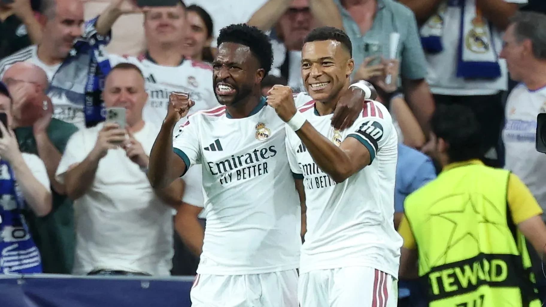 Two Real Madrid players celebrating a goal
