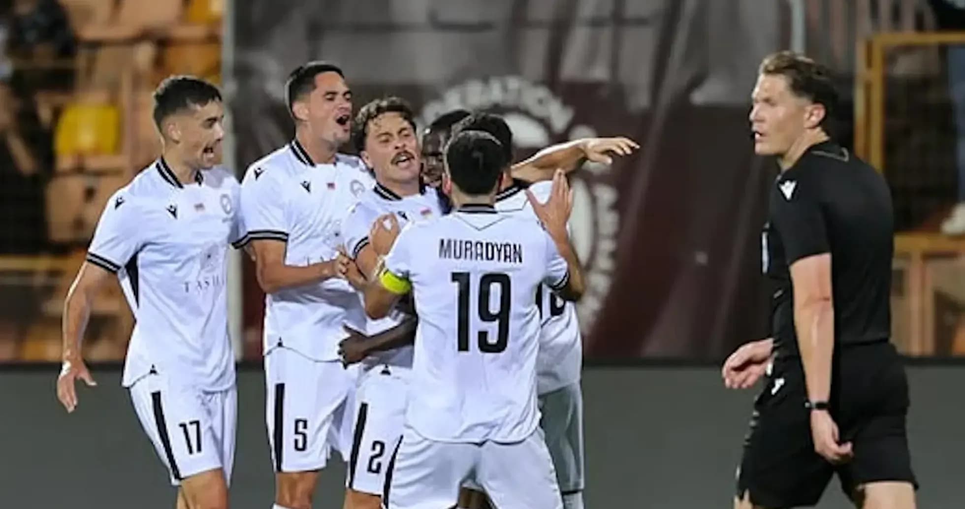 Players celebrating a goal in UEFA Champions League