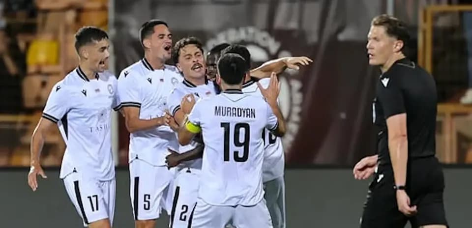Players celebrating a goal in UEFA Champions League