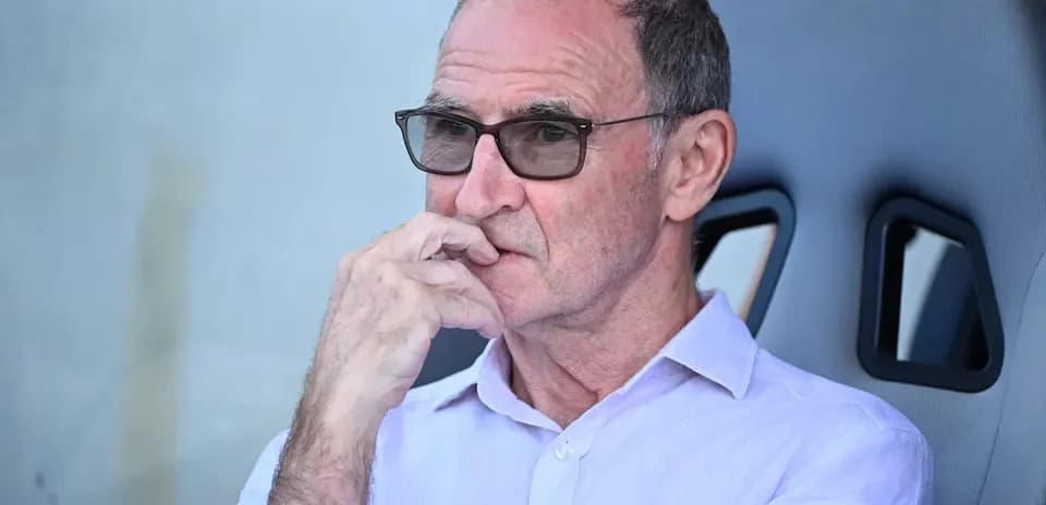 Man observing from team bench during match
